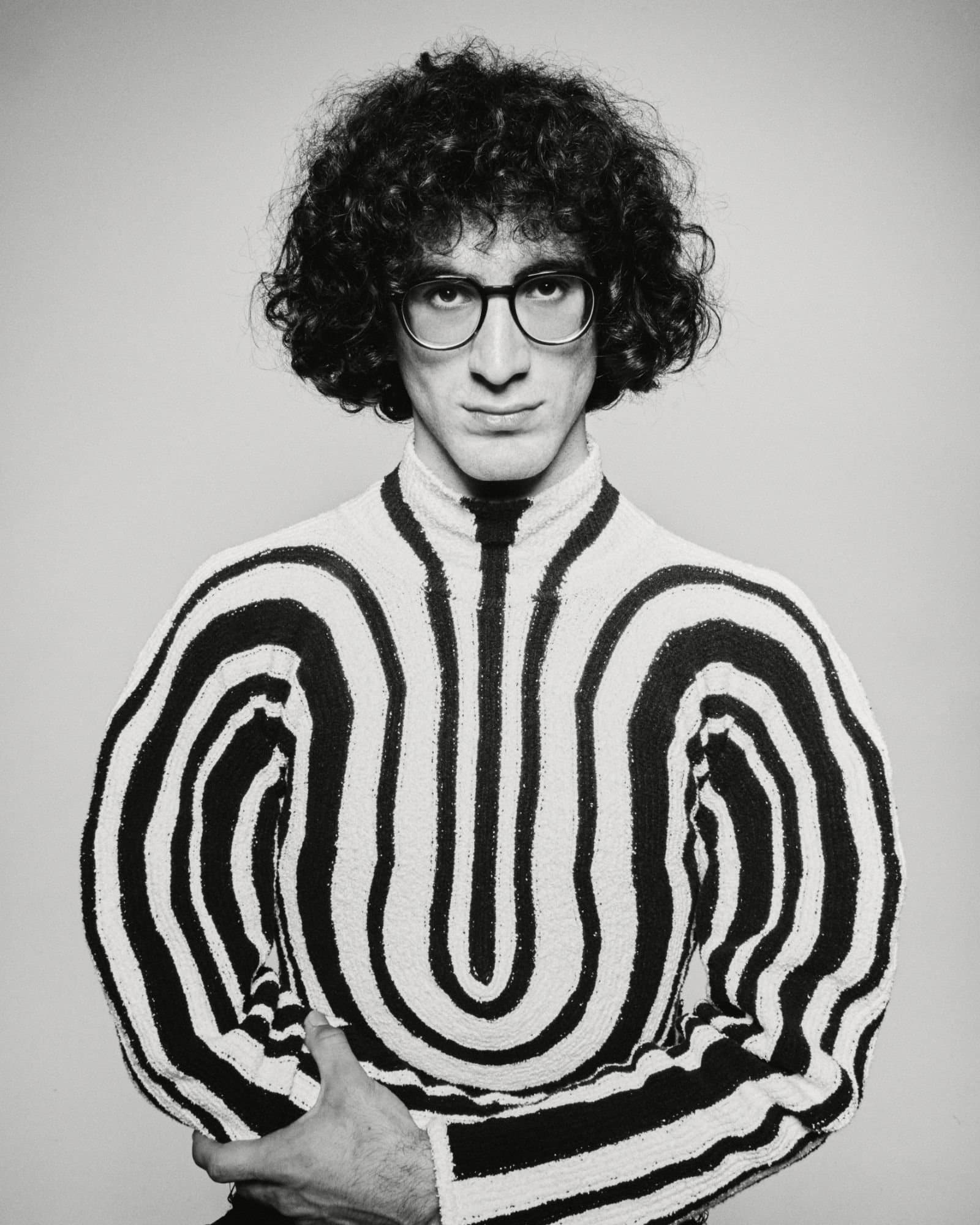 Giorgi Gigashvili in a striped sweater